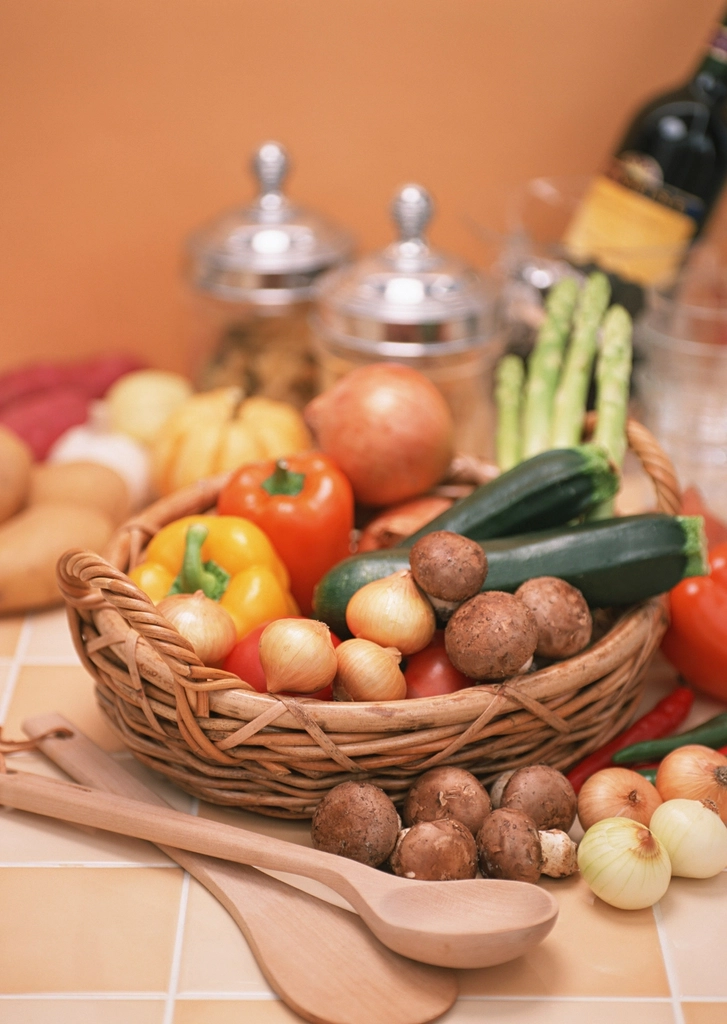 Basket of fresh vegetables in warm light