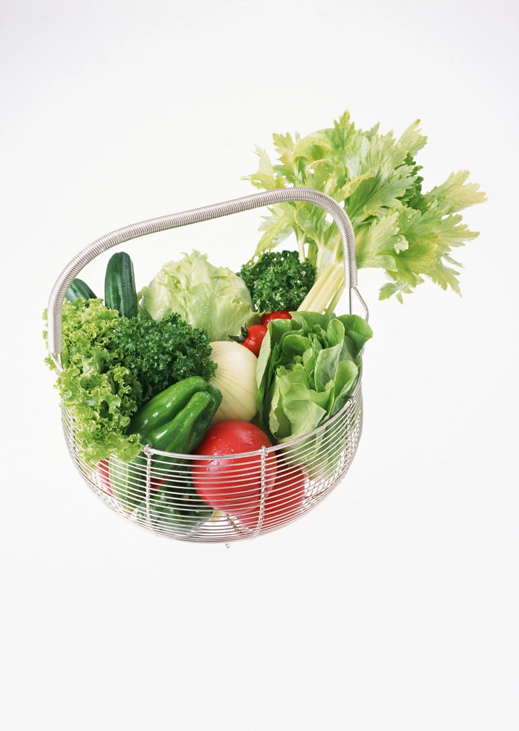 Wire basket of fresh vegetables