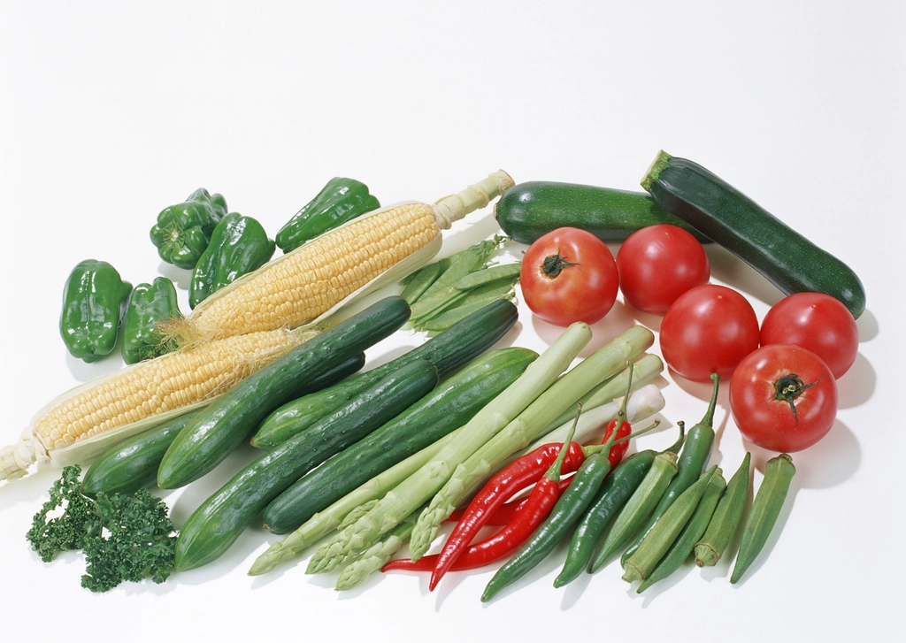 Fresh vegetables arranged on white