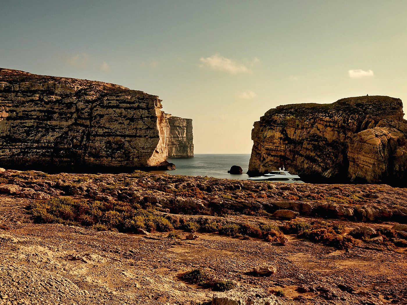The Dwejra coast on Gozo, with Fungus Rock standing off the headland